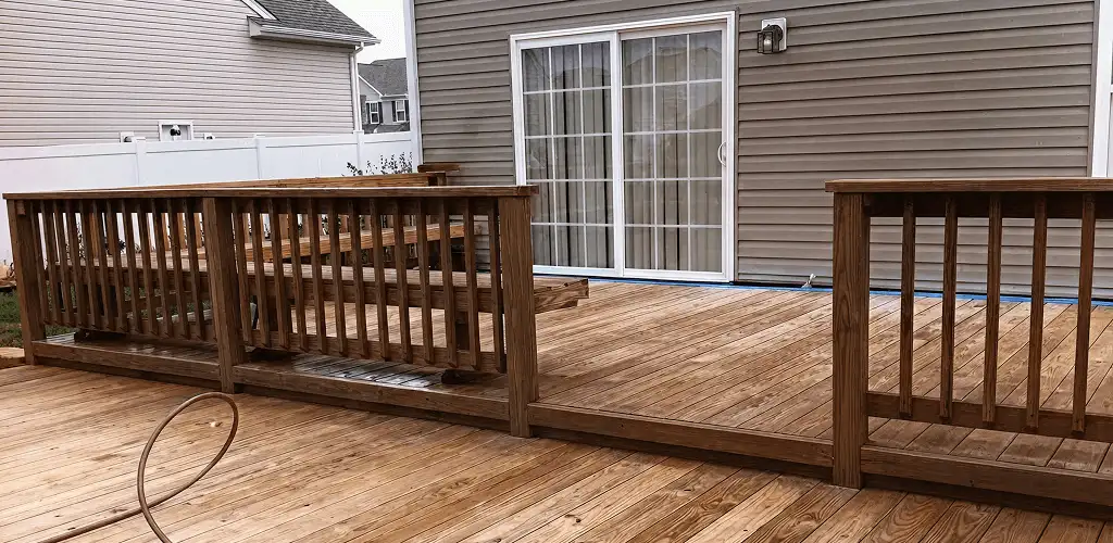 Deck sealing service protecting a backyard wood deck and railings in Pittsburgh, PA