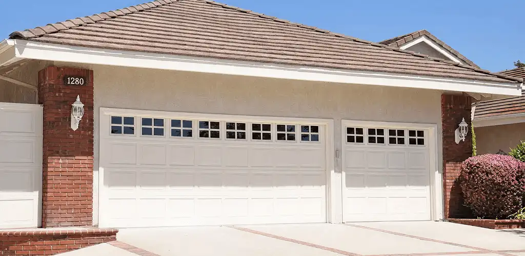 Residential garage door repair service for a double garage door in Pittsburgh, PA