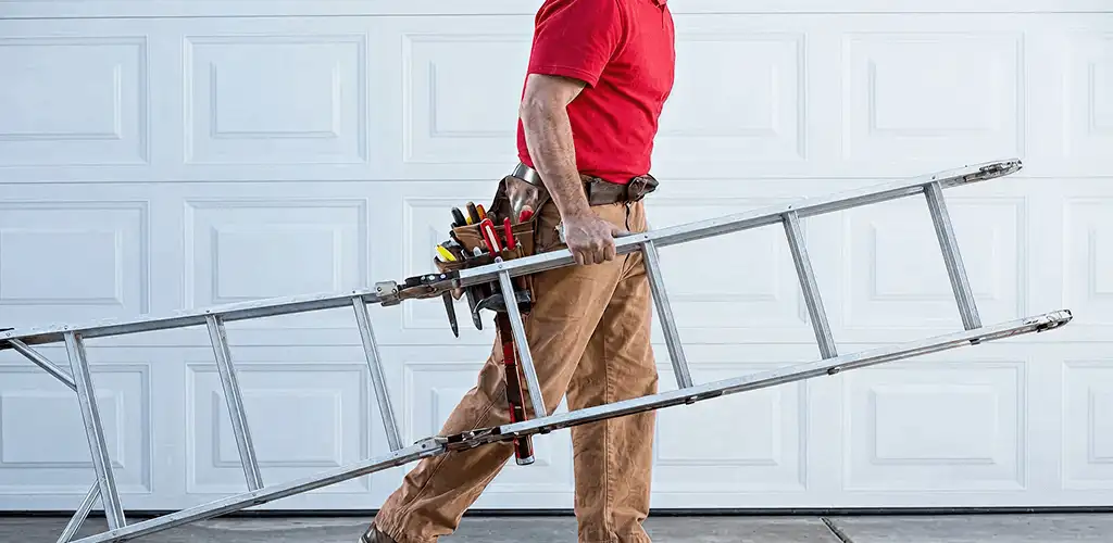 Garage door repair technician arriving with tools and ladder in Pittsburgh, PA