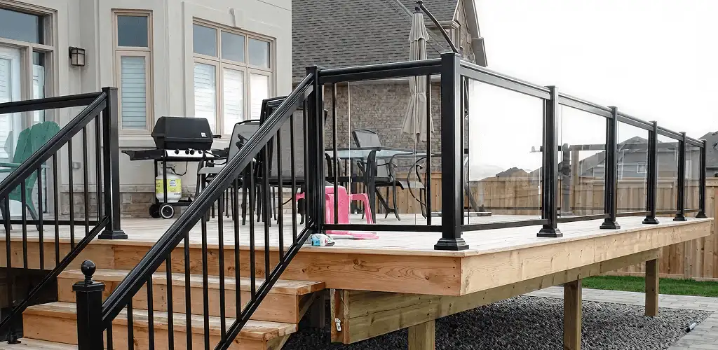Handrail installation on a deck staircase for safety and code compliance in Pittsburgh, PA